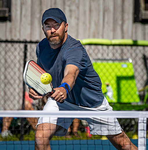 man playing pickleball